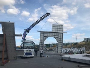 A stainless steel platform being lifted into place